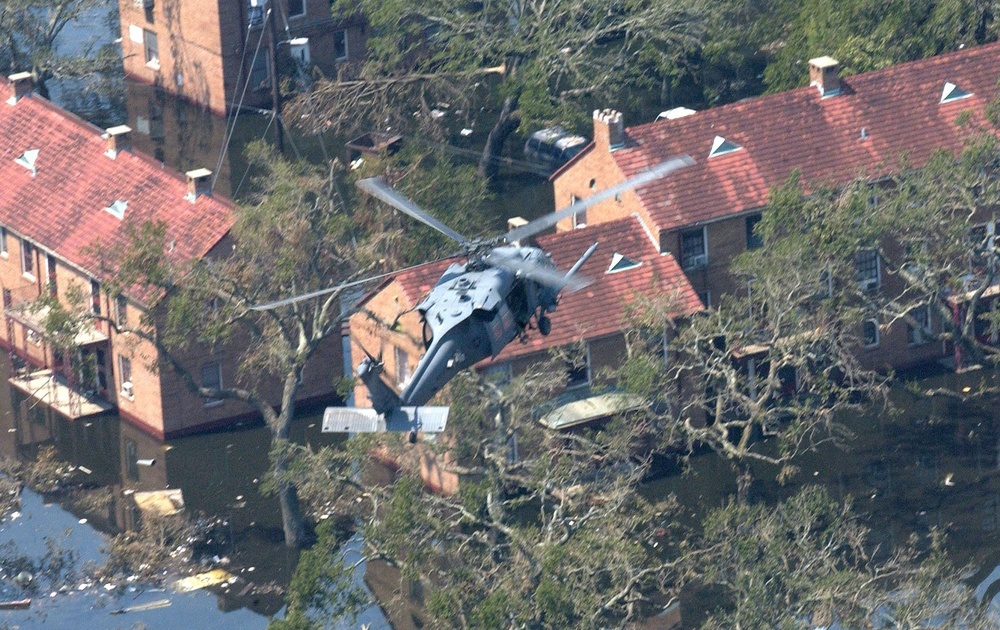 A UH-60 Black Hawk helicopter maneuvers for a rescue in downtown New Orleans