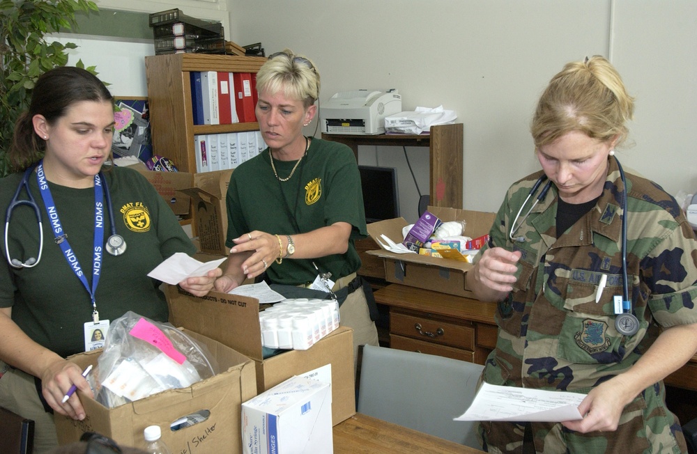 COL Burgess and FEMA workers check medical supplies
