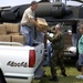 Meals Ready to Eat are offloaded onto a civilian truck