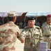 Lt. Gen. Aziz Abdul Al Rahman presents a gift  to a distinguished graduate