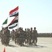 The Iraqi colors pass in review at the IED graduation ceremony