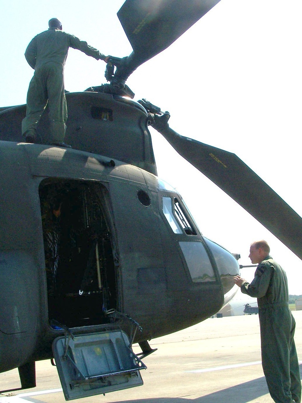 CW3 Upshaw inspects the rear engines during a preflight check