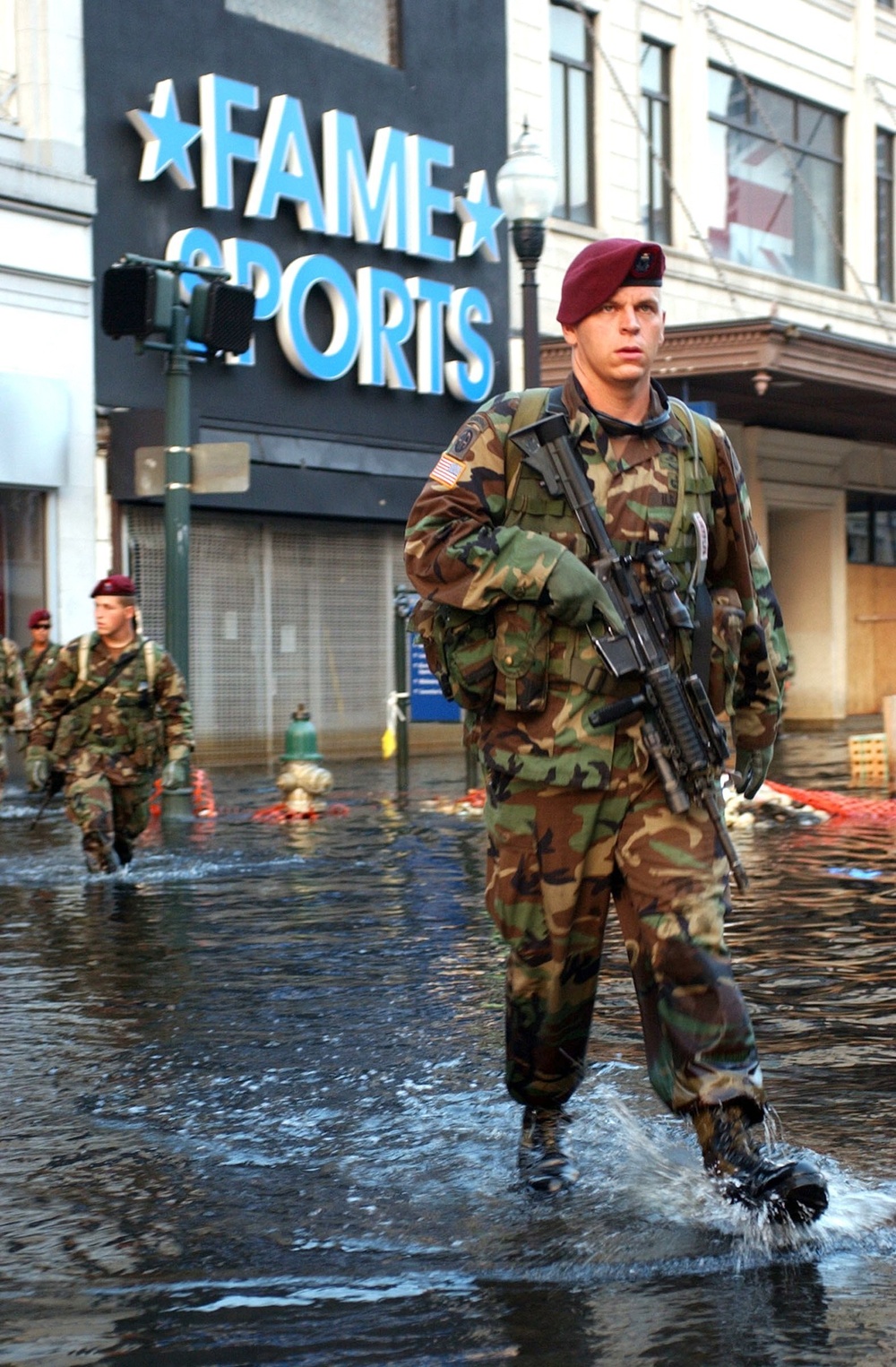 Sgt. Daniel Loeffler and his team treads their way through the flooded stre