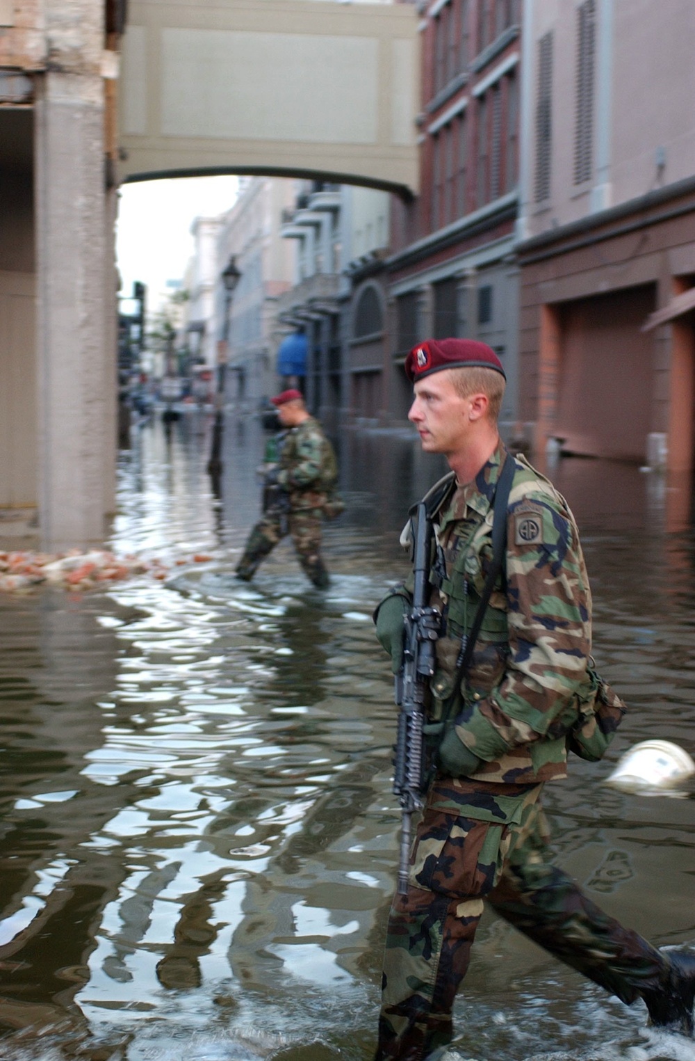 Paratroopers tramp through ankle-high water during a presence patrol