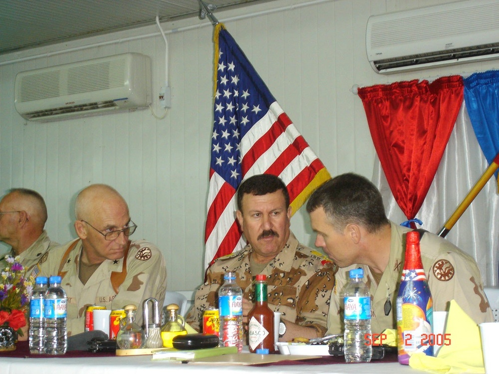 Lt. Col. Johnson speaks with Brig. Gen. Gayhart and Maj. Gen. Amin