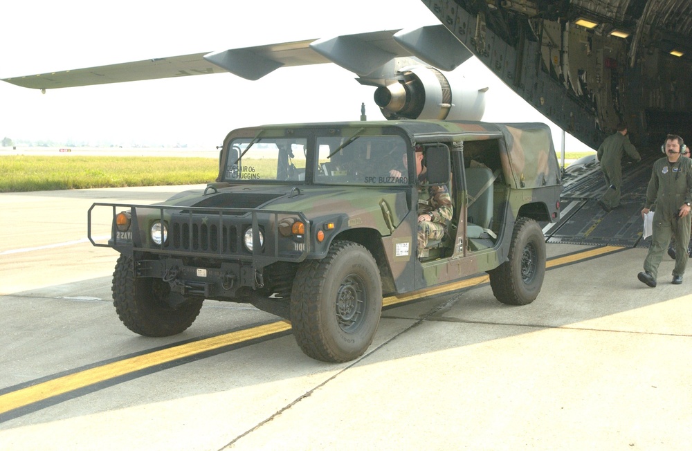 Humvee unloaded onto tarmac