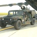Humvee unloaded onto tarmac