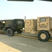 Humvee unloaded onto tarmac
