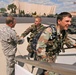 BG Kambic greats Service members as they board an aircraft