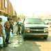 Ohio Guard members load ice bags into civilian vehicles