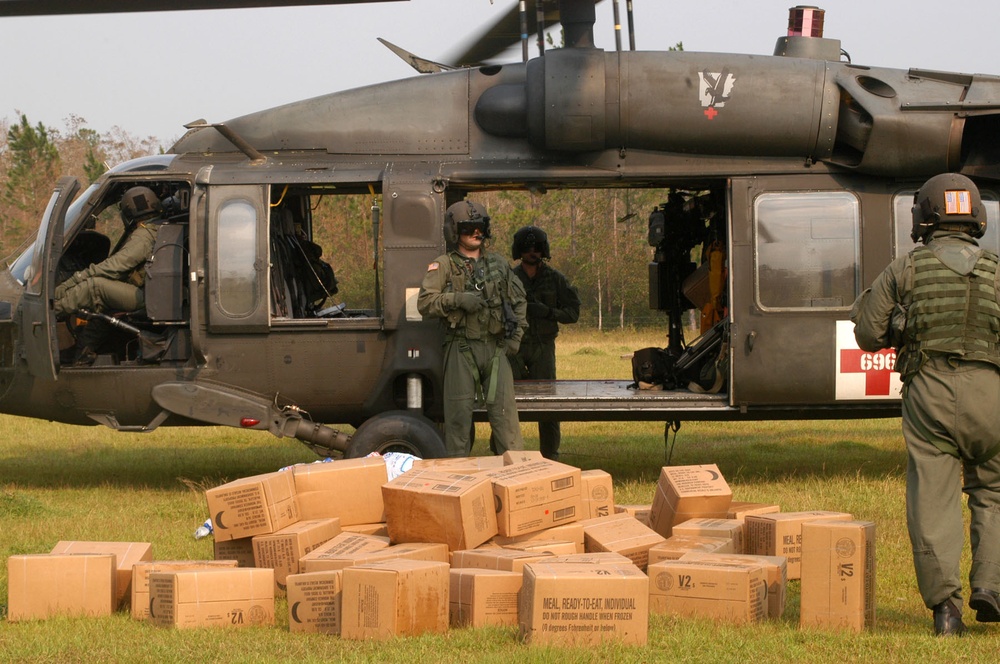 Arkansas Army National Guard soldiers drop off food and ice