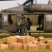 Arkansas Army National Guard soldiers drop off food and ice