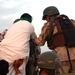 Iraqi army Soldiers load prisoners onto a truck