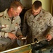 Maj. Cole and Lance Cpl. ryan prepare the parts to build a Q36 space modula