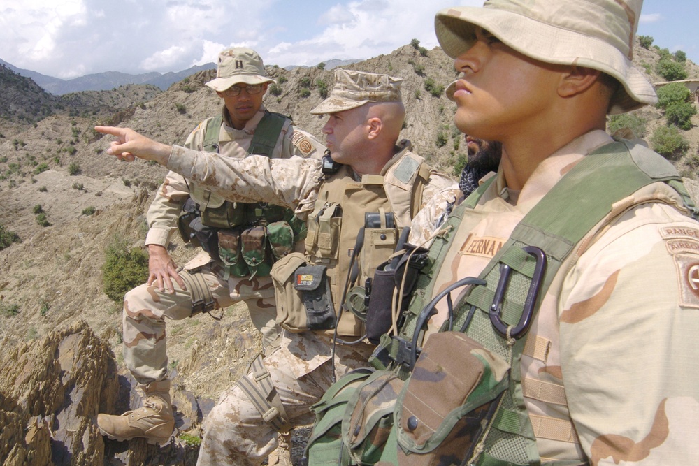 Capt. Barr points out a terrain feature to fellow officers