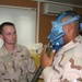 Senior Airman Rob Wolfe instructs 1st Lt. John Hurley how to wear a quick-d