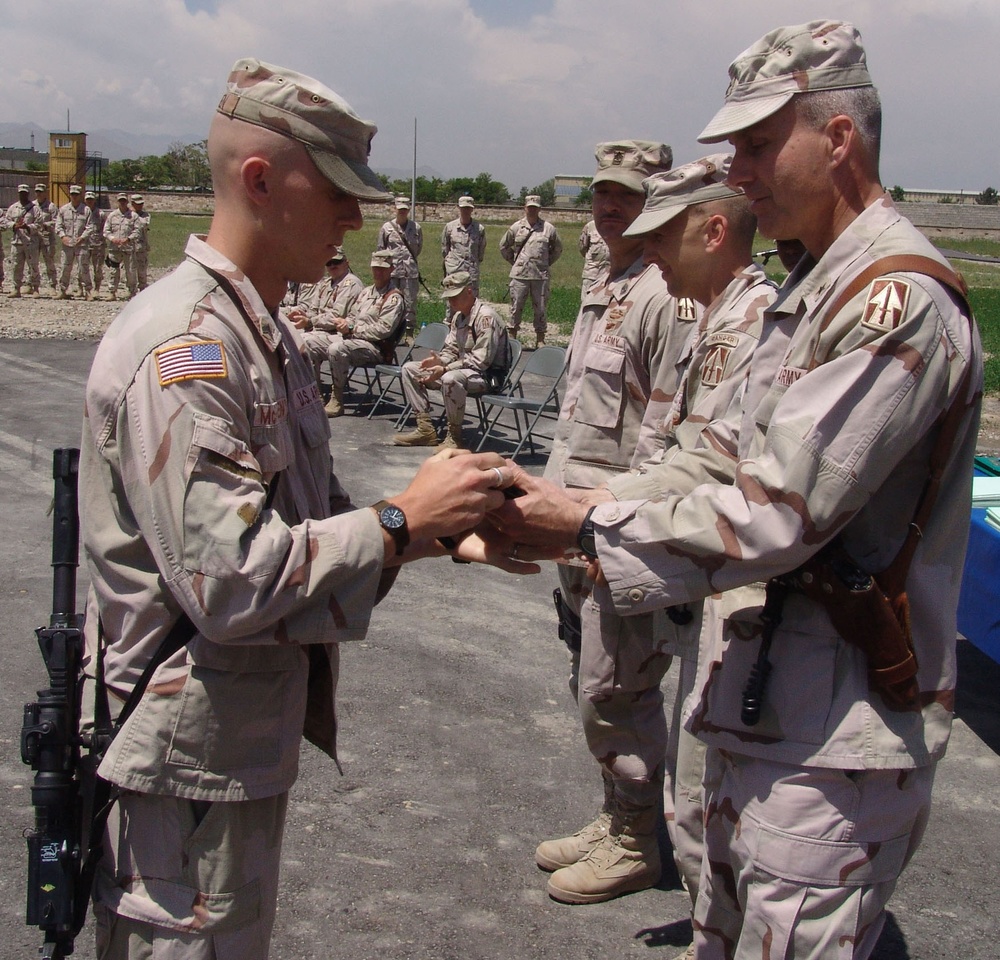 Sgt Joe McFarren receives an Honor Grad knife