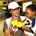 Debbie Alberts of the American Red Cross holds Kaylop who was ev