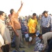 Iraqi policemen equally distribute soccer equipment for 25 teams in the Tir