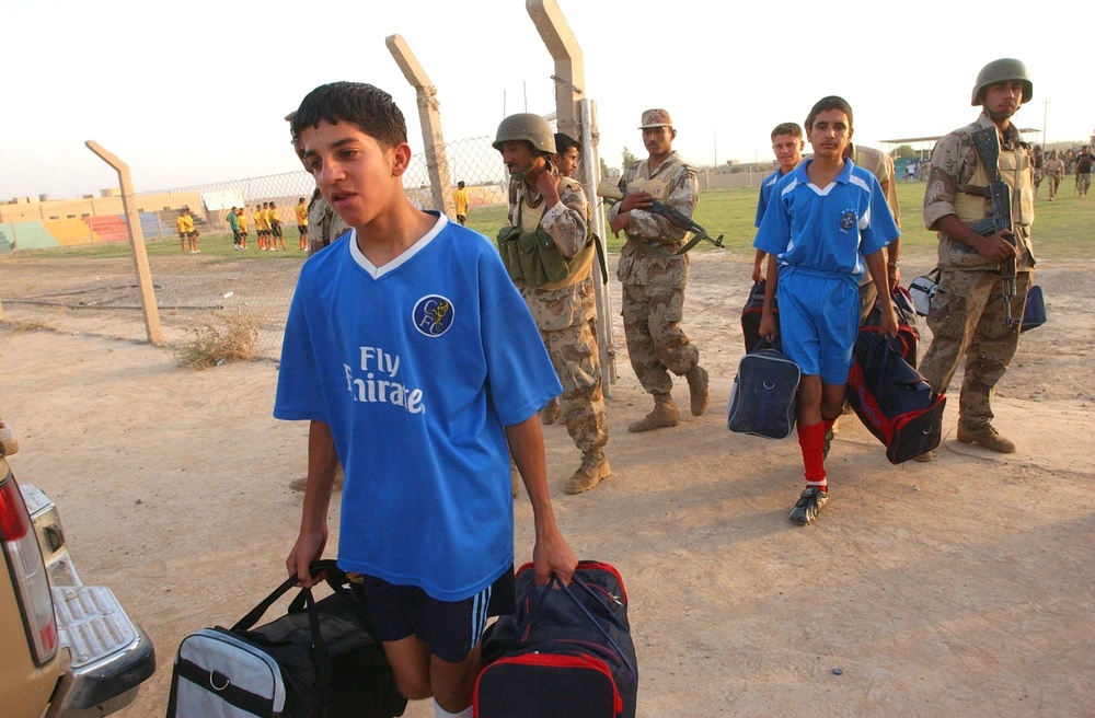 Iraqi soccer (football) players leave a soccer stadium where they were give
