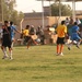 Iraqi boys play soccer (football) using the new uniforms distributed by Coa