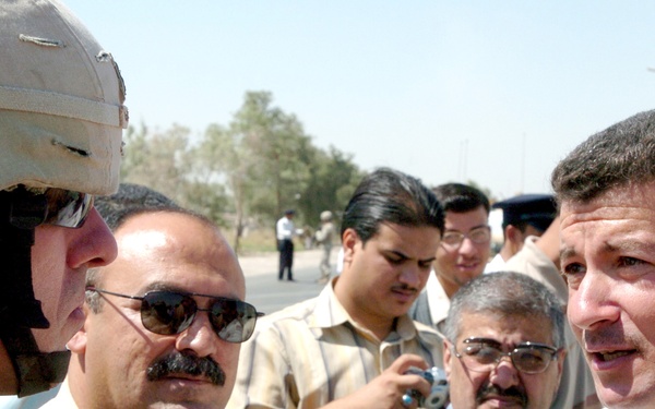 Lt. Col. Gayton speaks with District Advisory Council members at a ceremony