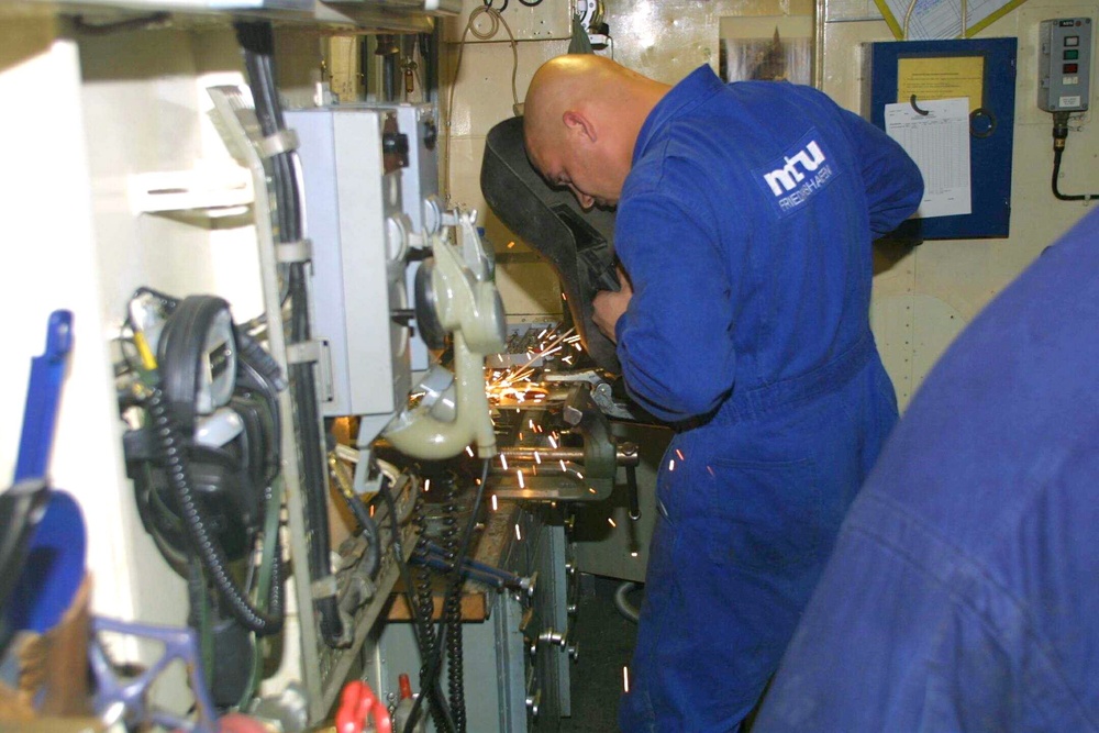 German Navy crewmen repair the AL ZAHID