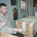 Sgt. Smith seals and labels a fellow Soldiers package to be sent home 2