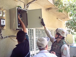 Capt. Siegrist shows employees frohow to properly check the fuse box for th