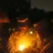 A Task Force Baghdad Soldier holds a candle during the 9/11 remembrance cer