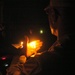 A Task Force Baghdad Soldier holds a candle during the 9/11 remembrance cer