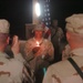 1st Lt. Shenell Watson holds a candle during the 9/11 remembrance ceremony