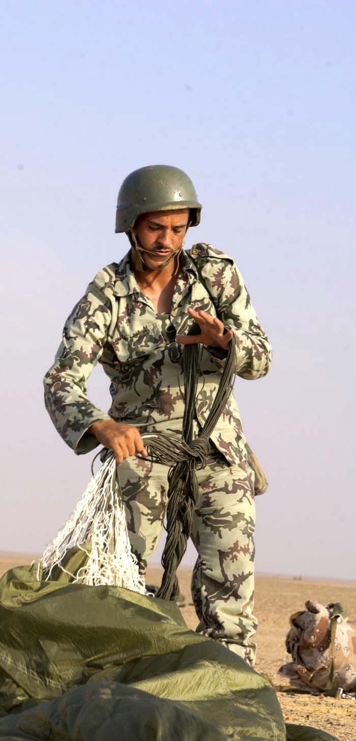 Cpl. Waled Kaere Abd El Mouth repacks his parachute 1