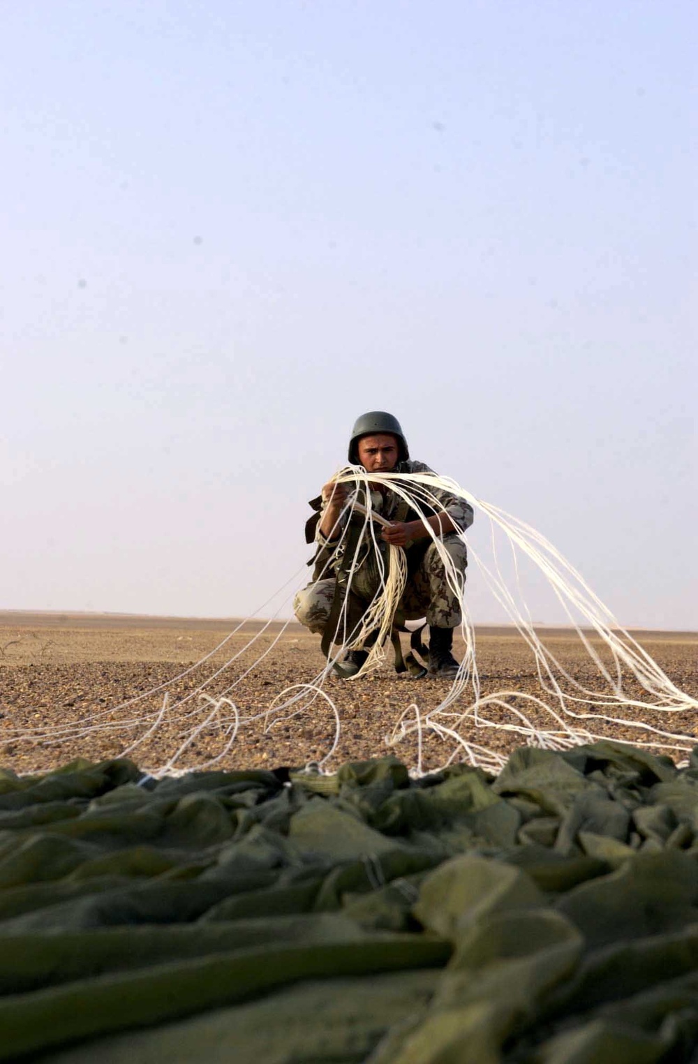 Cpl. Waled Kaere Abd El Mouth repacks his parachute 2
