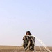 Cpl. Waled Kaere Abd El Mouth repacks his parachute 2