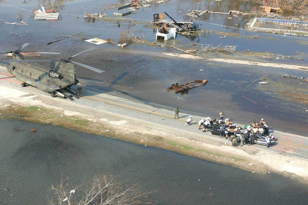 Members of a FEMA Search and Rescue Team Prepare to Board a CH-47 Chinook H