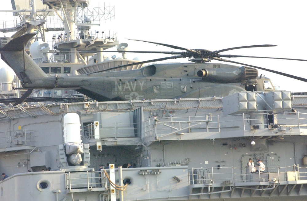 A Helicopter sits atop of the USS Iwo Jima