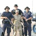 U.S. Customs Border Protection Officers pose with Spc. Van Buskirk