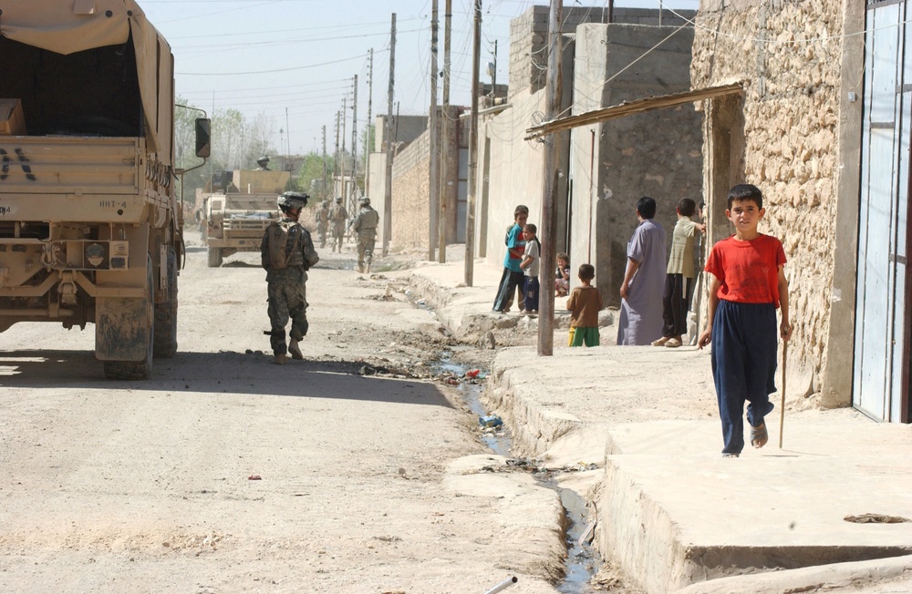 Residents of a secure area of Tall Afar came out of their homes to watch So