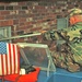 Sgt. Scott Crawford breaks through the window of a house during search and