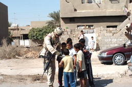 The children from North 60th Street gather around Sgt. Matthew See