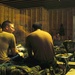 Soldiers use their rare free time to play dominos and cards