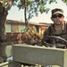 Sgt. 1st Class James Scally guides a boat along a flooded street