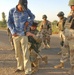 Staff Sgt. Derrick White searches a suspicious Iraqi male