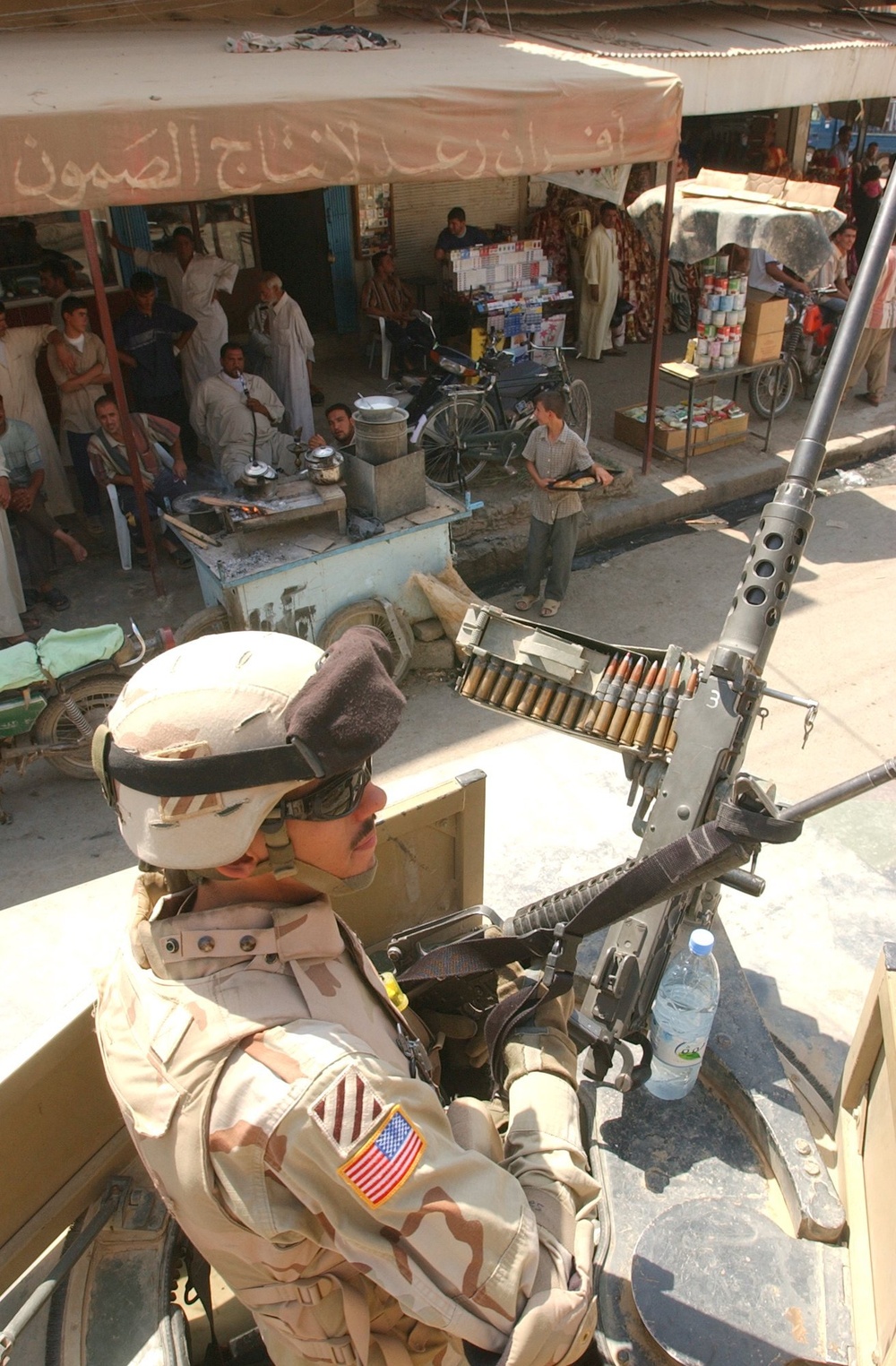 Pfc. Graves watches the people of Balad while patroling the city center