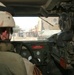 A Soldier drives through the city of Balad