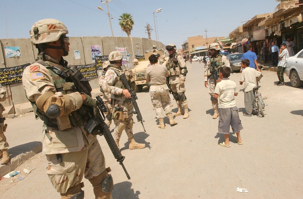 Soldiers return from a meeting about new police check points