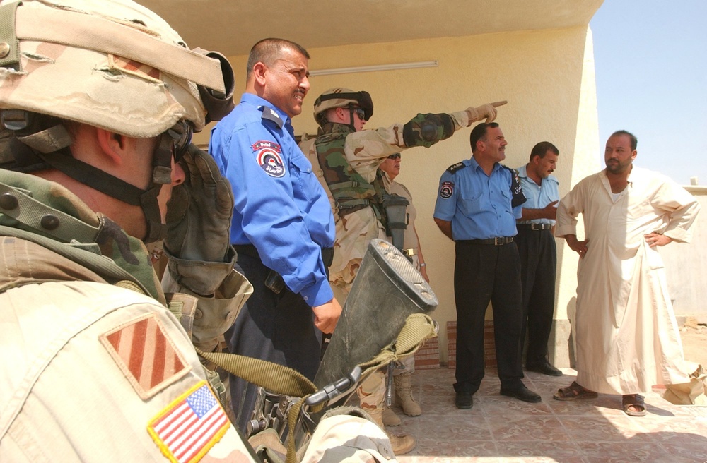 Lt Col. Petery discusses the building of a new police check point