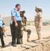 Iraqi policemen guard the Balad police chief and Lt. Col. Petery