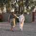 Sgt. 1st Class Perez escorts a detainee